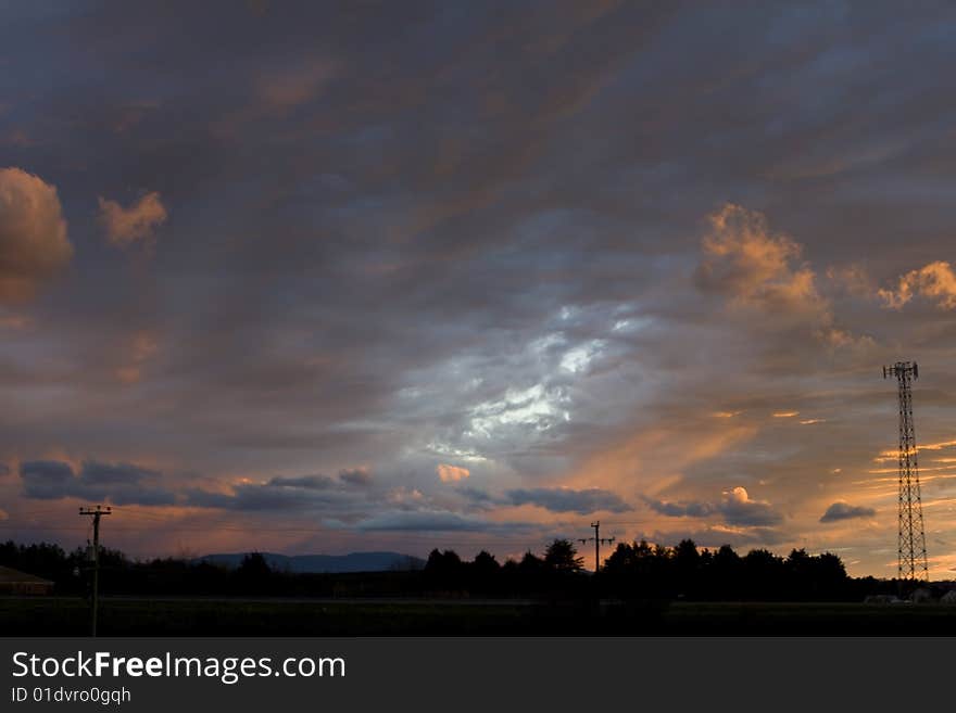 Bright colorful sunset with landscape outline. Bright colorful sunset with landscape outline.