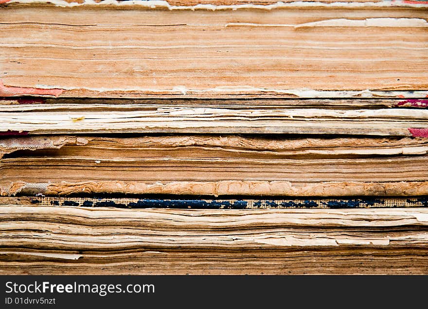 Background made of a stack of aged books. Background made of a stack of aged books