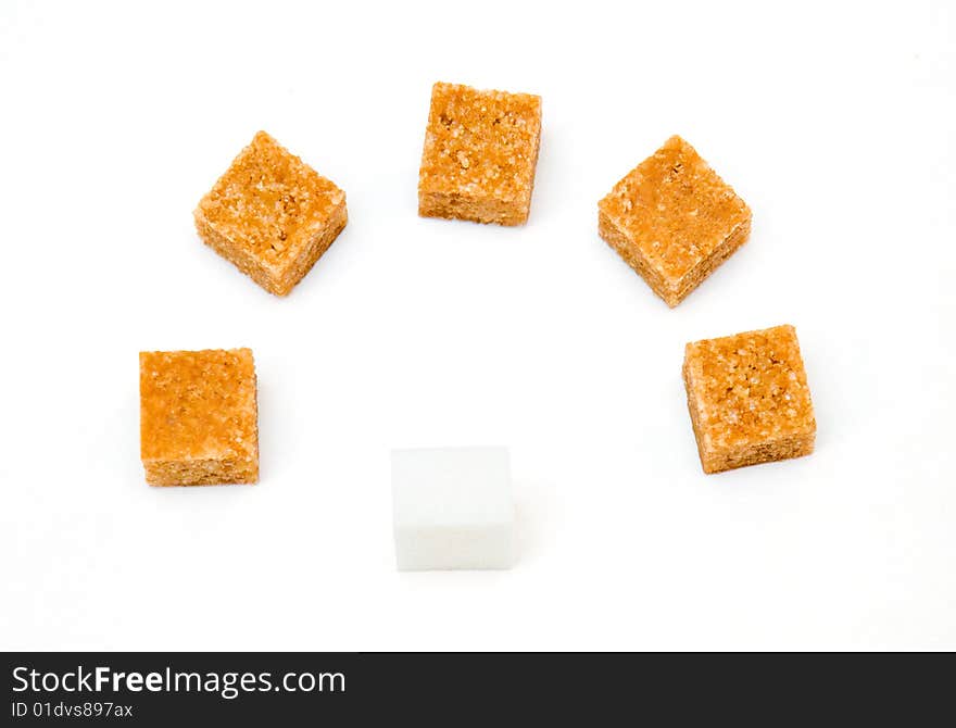 Block of white sugar before five blocks of brown sugar isolated on white background. Block of white sugar before five blocks of brown sugar isolated on white background