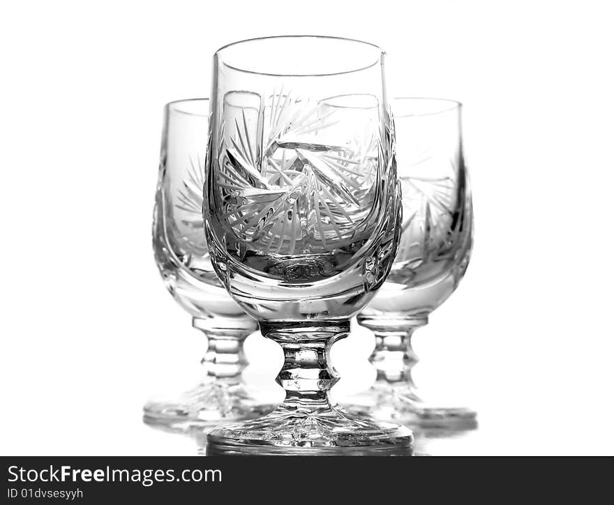 Three crystal glasses isolated on white