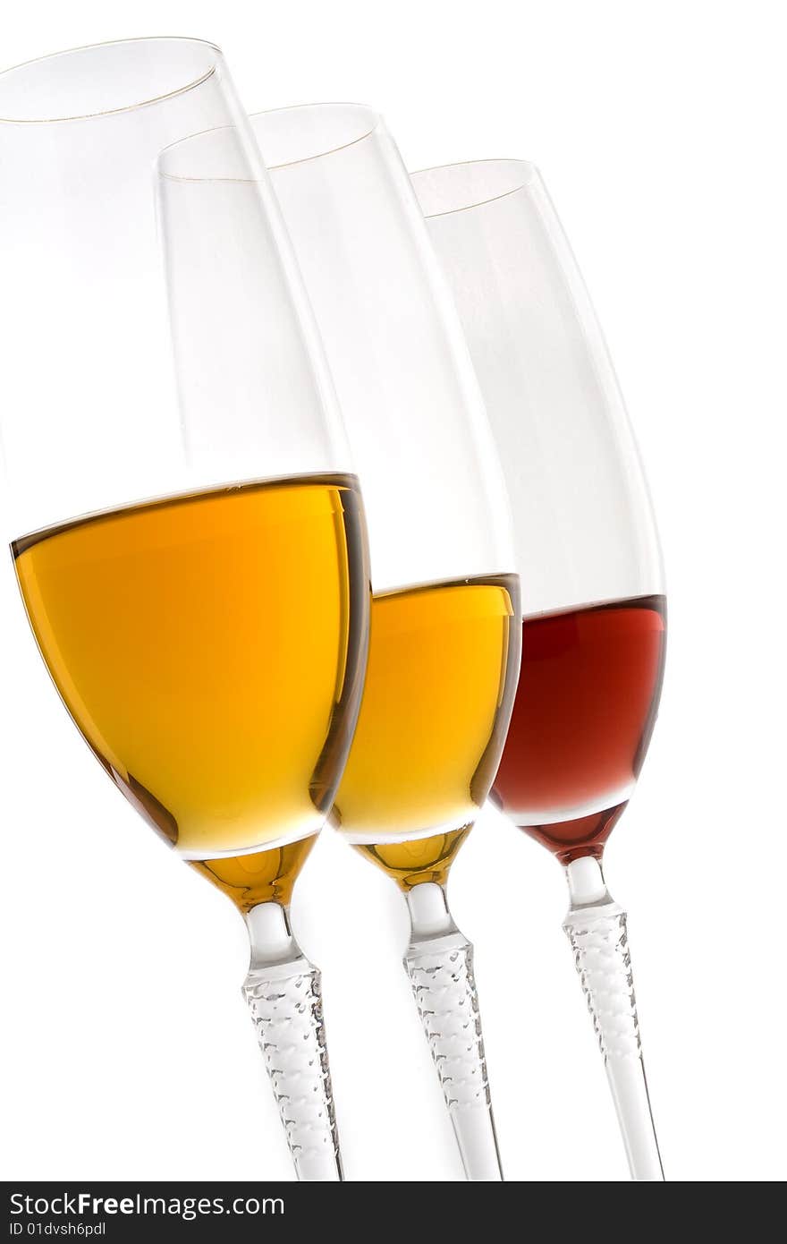 Glasses of red and white wine on white background