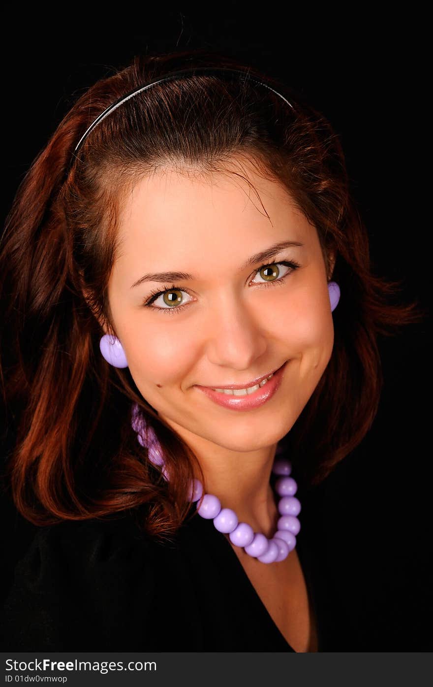 Portrait of a beautiful woman on a black background