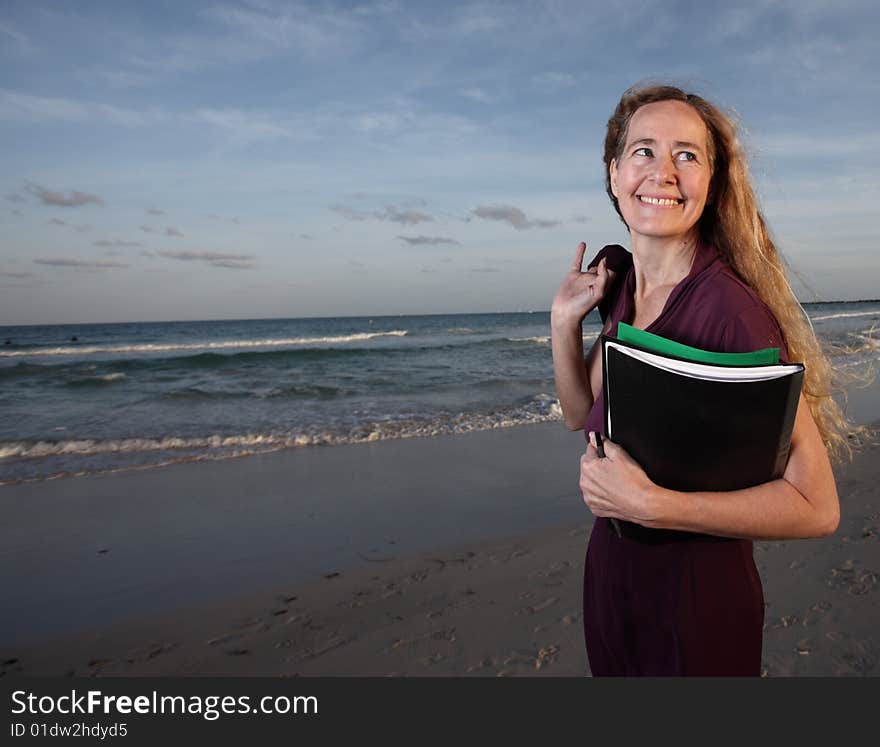 Smiling secretary on the beach