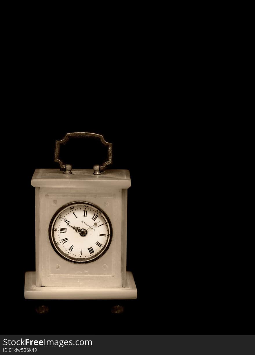 Old marble table clock on black background. Old marble table clock on black background