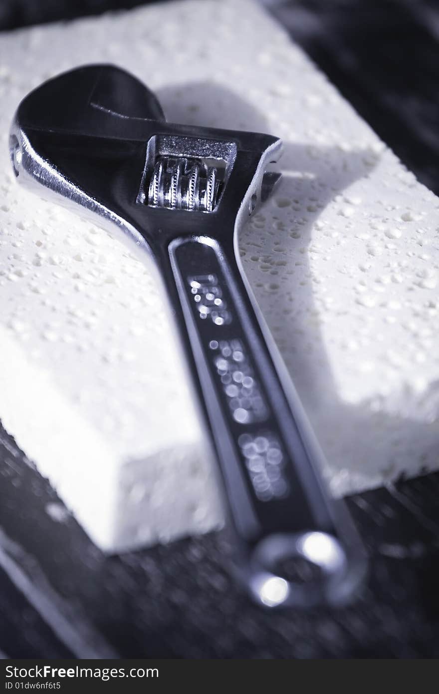 Adjustable wrench on a sponge