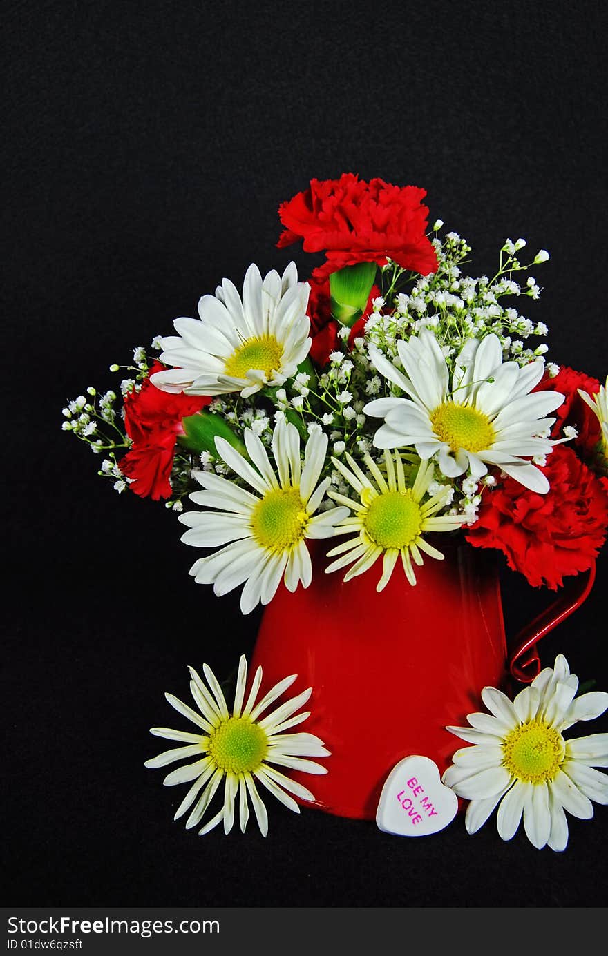 Valentine bouquet with heart candy in red pitcher. Valentine bouquet with heart candy in red pitcher.