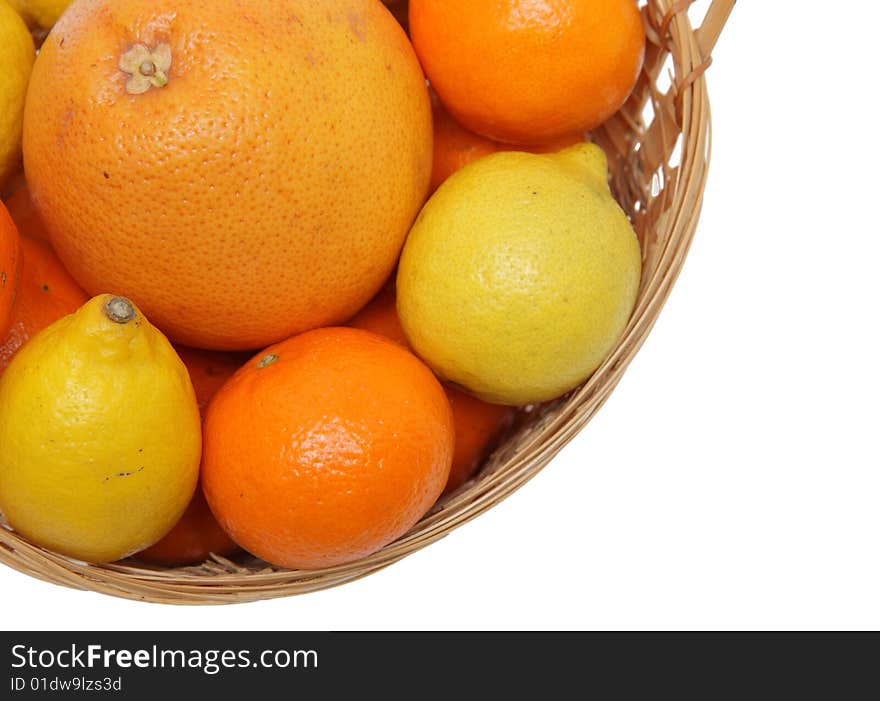 Basket wth grapefruit, lemons and oranges .