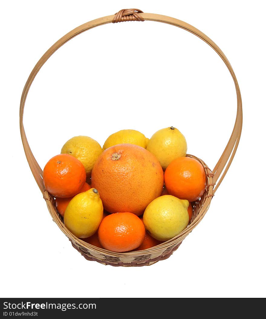 Basket wth grapefruit, lemons and oranges .