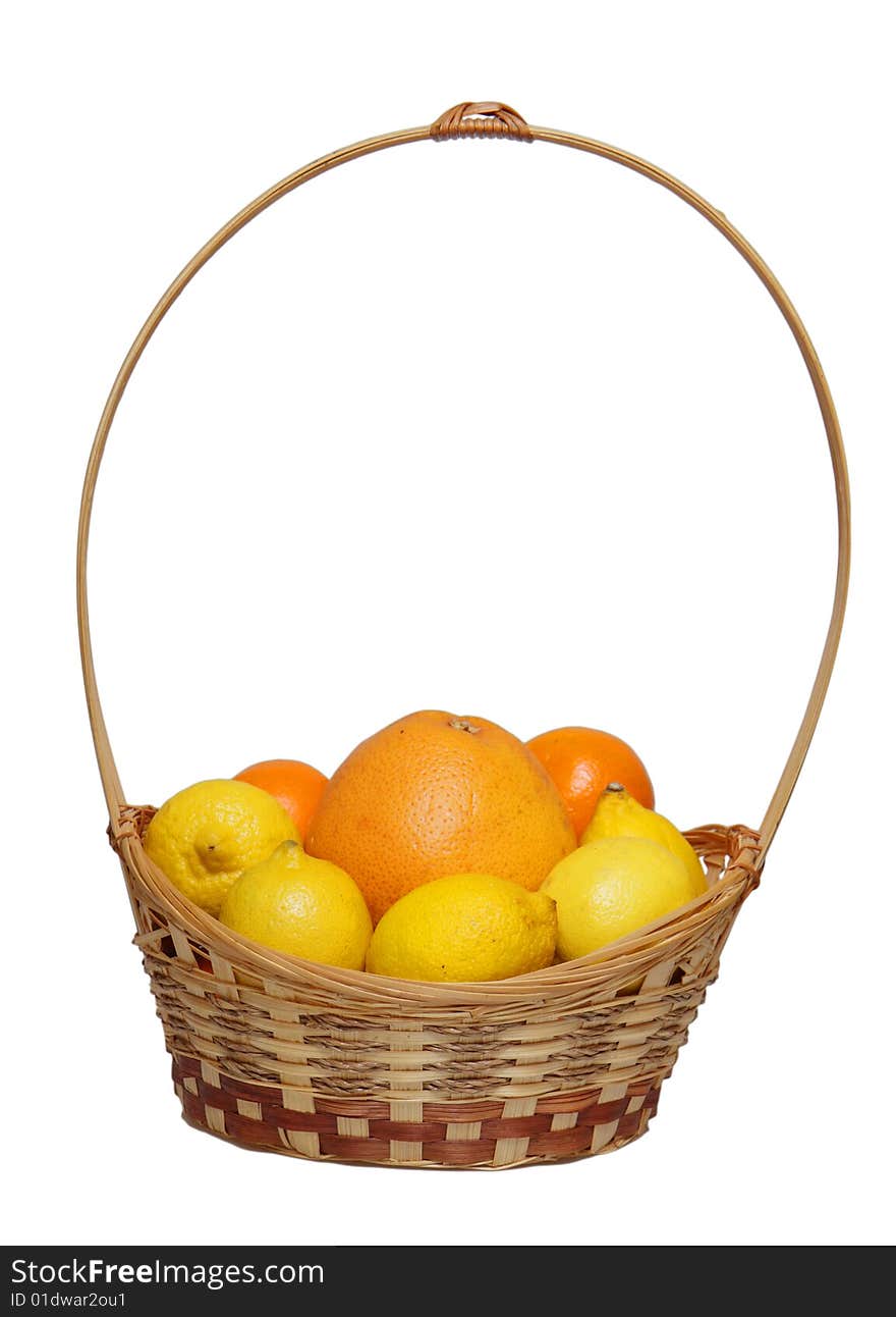 Basket wth grapefruit, lemons and  oranges .