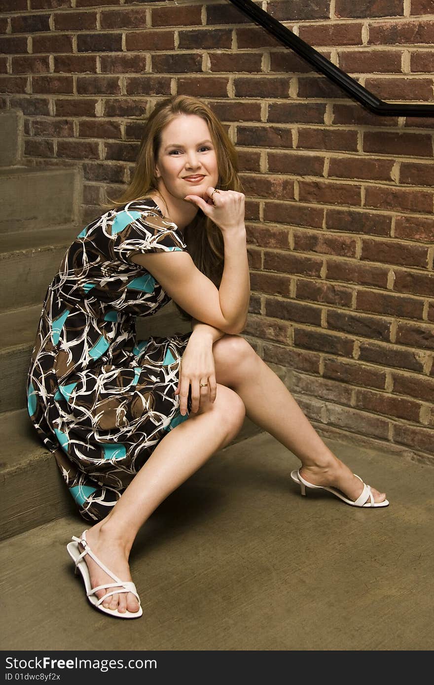 Young Woman with a Thinking Pose on Steps