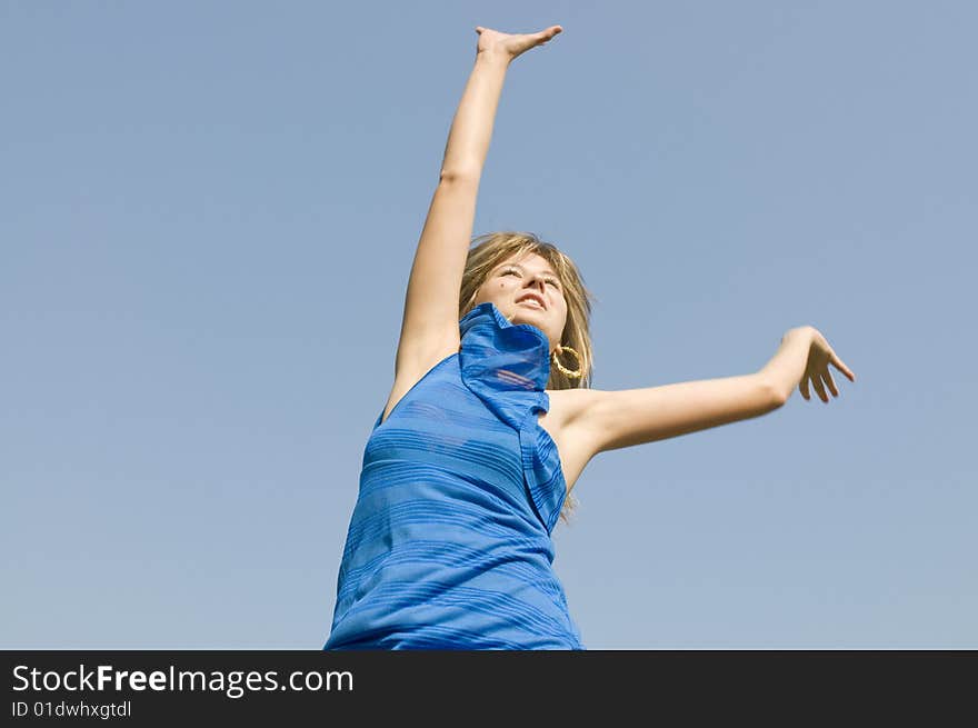 Jumping teenager on background of blue sky