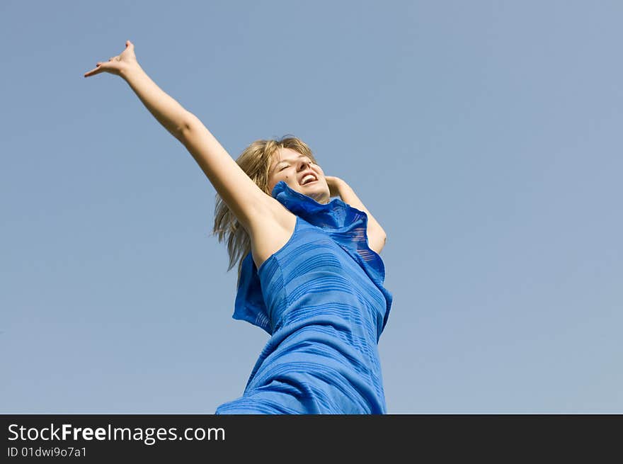 Jumping teenager on background of blue sky