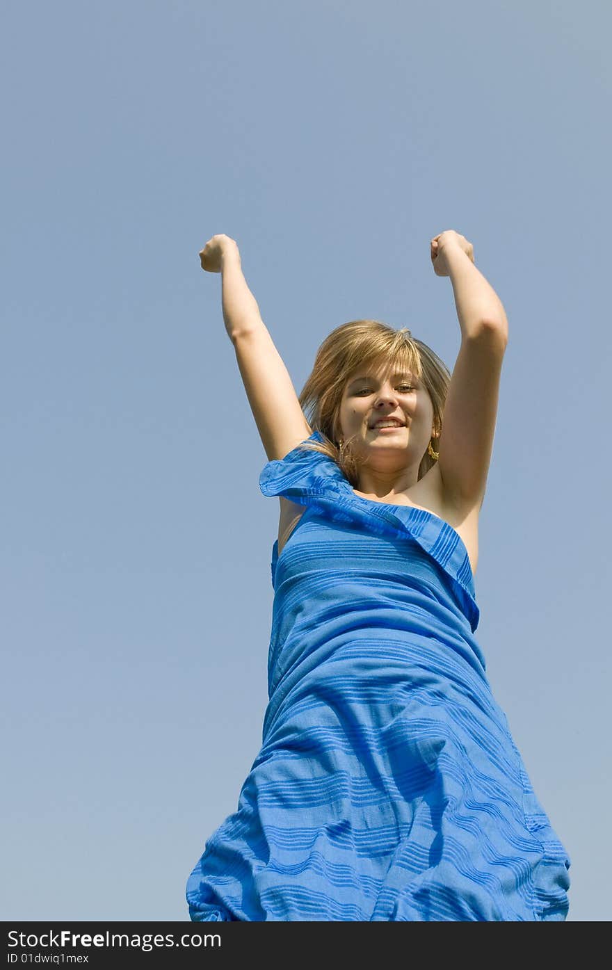 Jumping teenager on background of blue sky