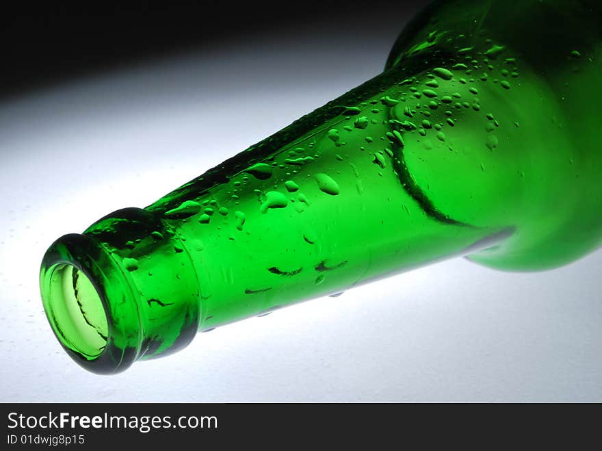 Neck 
of 
a 
green 
bottle 
and 
drop. Neck 
of 
a 
green 
bottle 
and 
drop