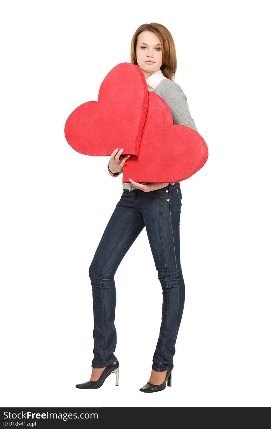 Pretty model girl holding two hearts over white