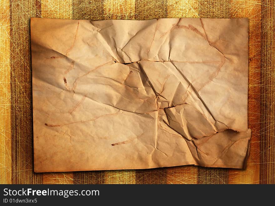 Old natural scratched wooden desk with old paper. Old natural scratched wooden desk with old paper