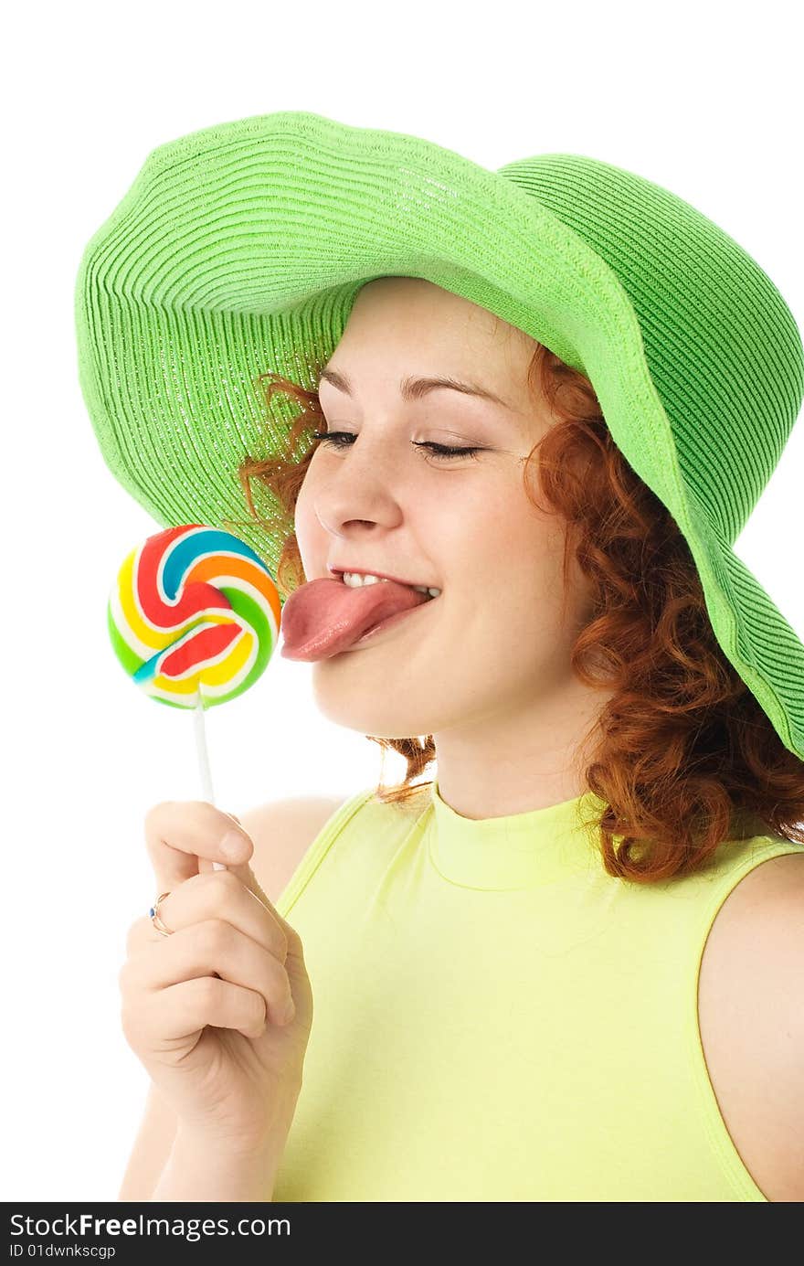 Happy woman eating a candy isolated against white background