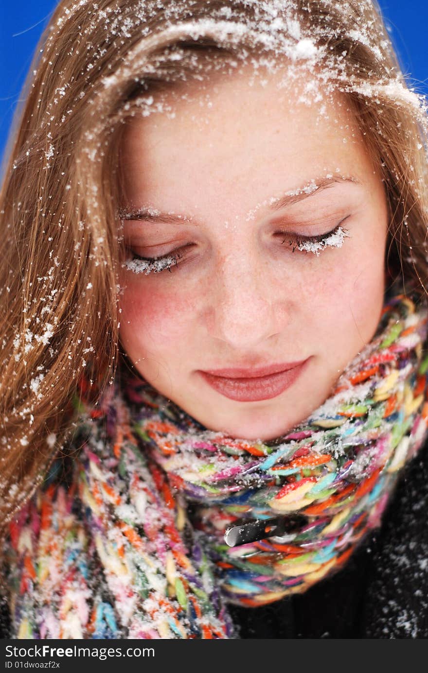 Beautiful young woman with snow on her hair. Beautiful young woman with snow on her hair