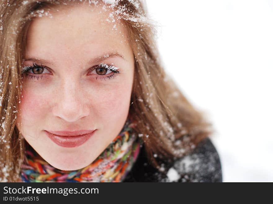 Beautiful young woman with snow on her hair. Beautiful young woman with snow on her hair