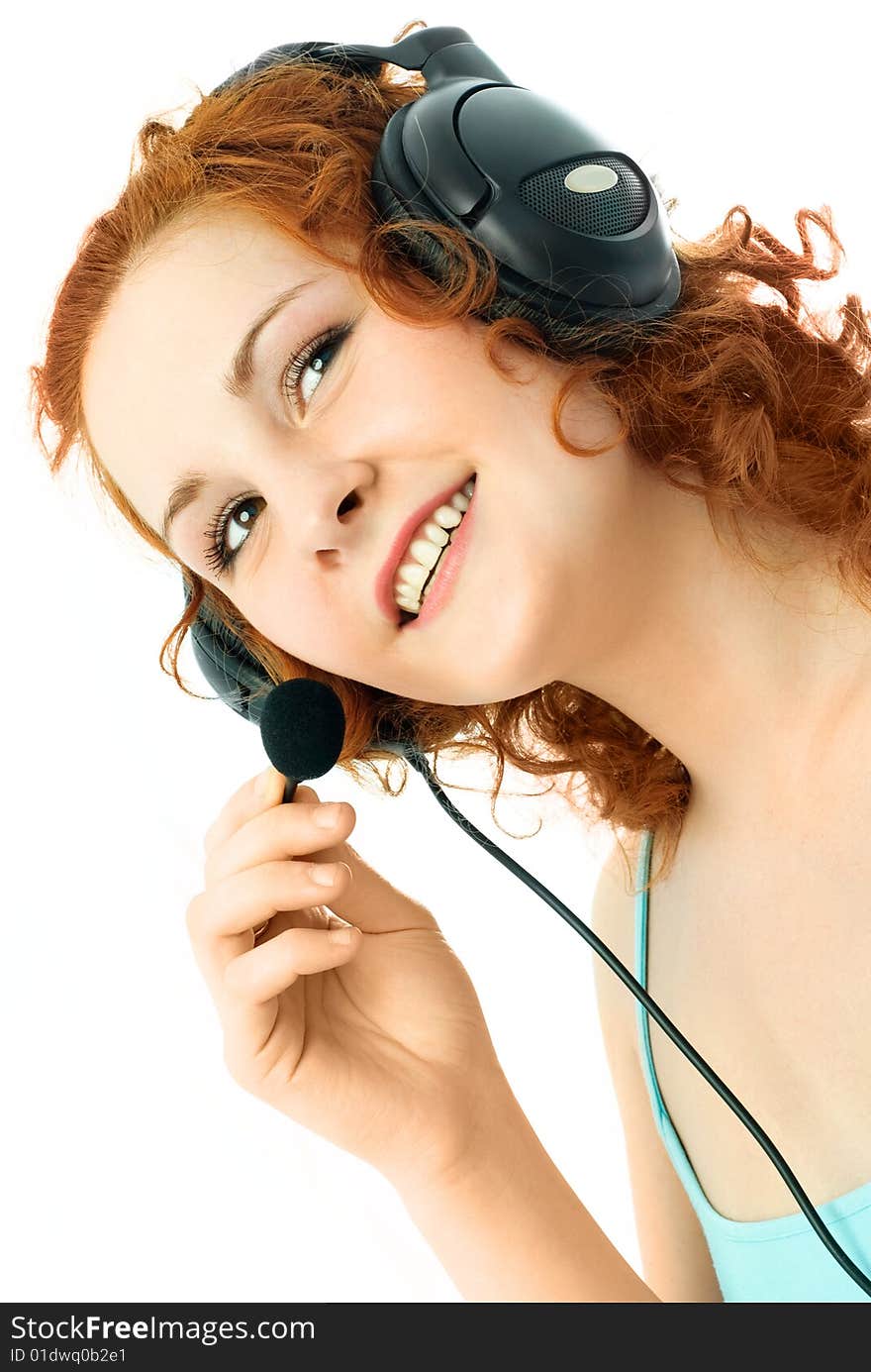 Beautiful young woman with curly ginger hair wearing earphones. Beautiful young woman with curly ginger hair wearing earphones