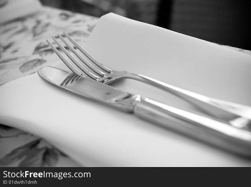 Black and white fork and knife on the table. Black and white fork and knife on the table