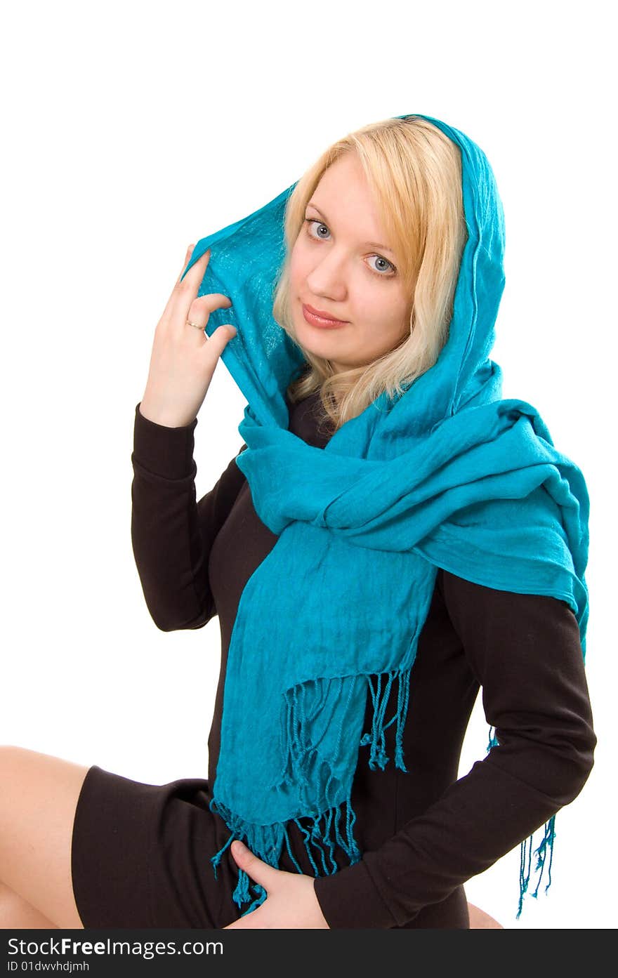 Beautiful blond lady in blue scarf sitting on the chair, white background