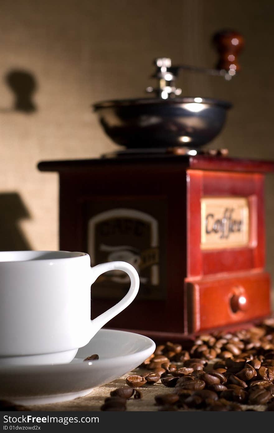 Still life with cup of coffee and coffee-cup on the sack