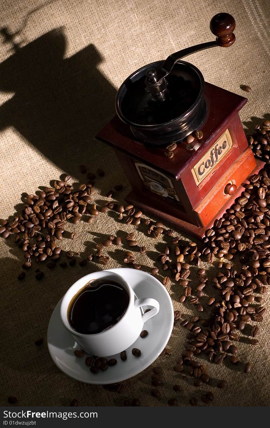 Still life with cup of coffee and coffee-cup on the sack