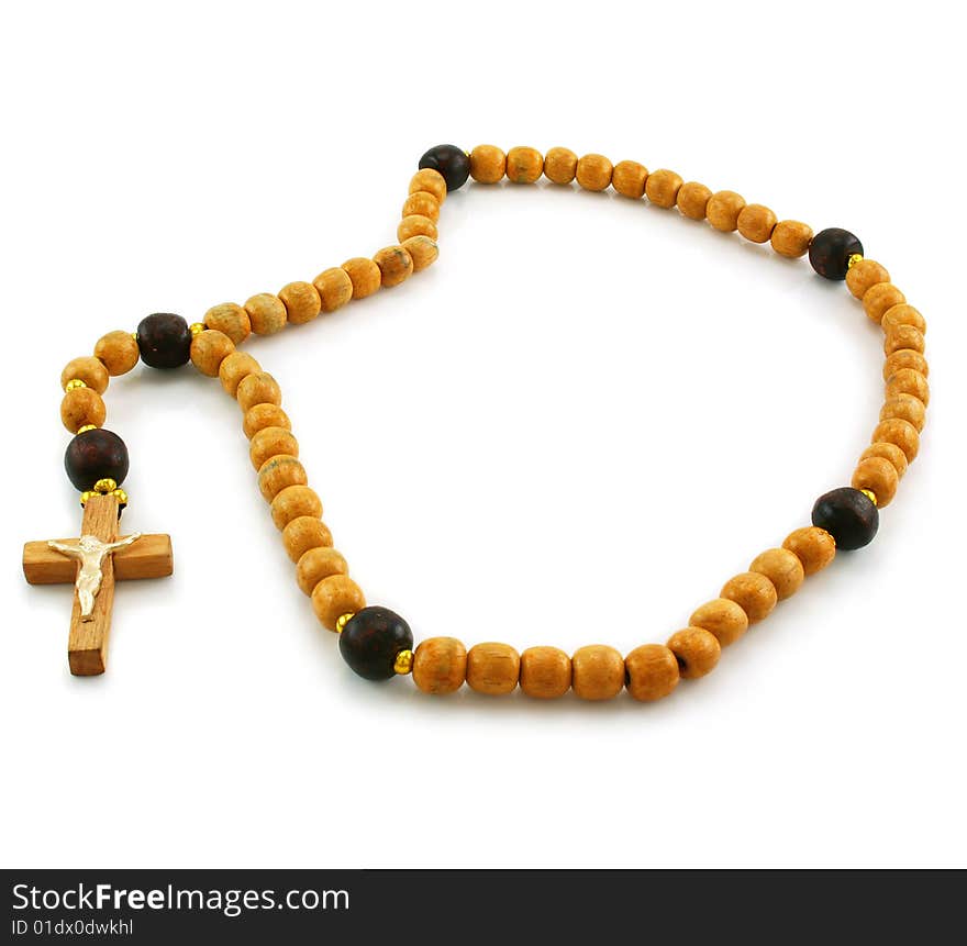 Wooden rosary and cross isolated on a white background