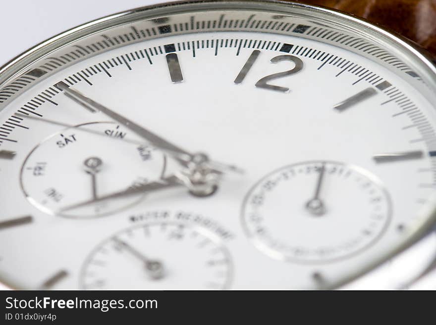 Close-up photo of a wrist watch with copyspace and focus on 12 sign. Close-up photo of a wrist watch with copyspace and focus on 12 sign