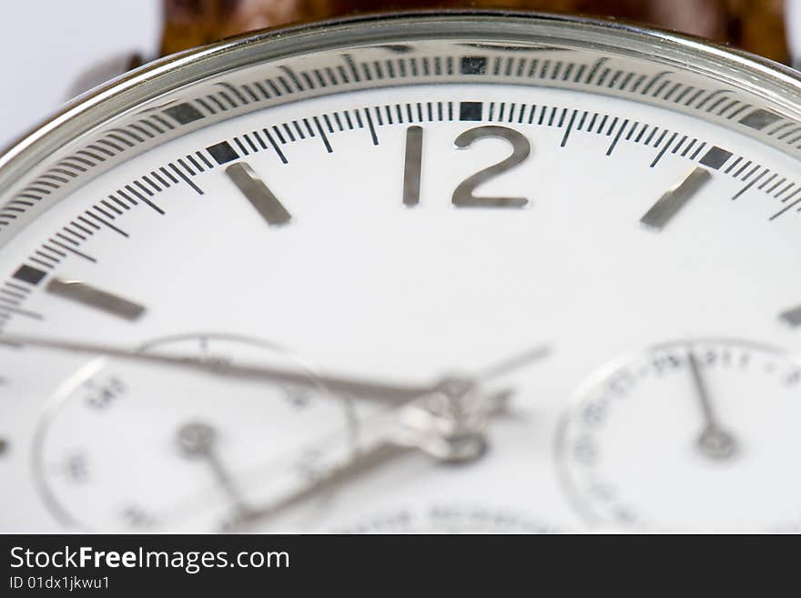 Close-up photo of a wrist watch with copyspace and focus on 12 sign. Close-up photo of a wrist watch with copyspace and focus on 12 sign