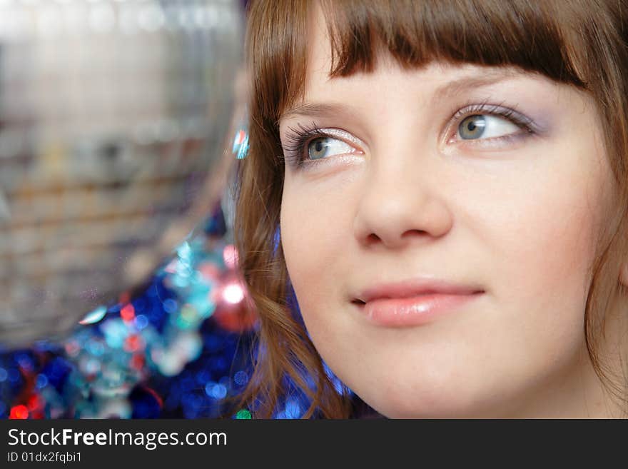 Portrait of beautiful young lady and disco ball closeup. Portrait of beautiful young lady and disco ball closeup