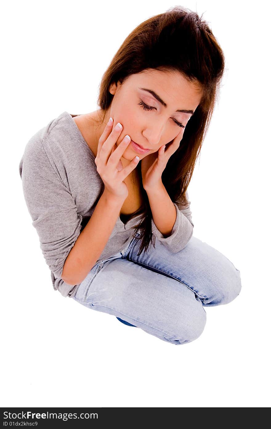 Sitting young woman with closed eyes