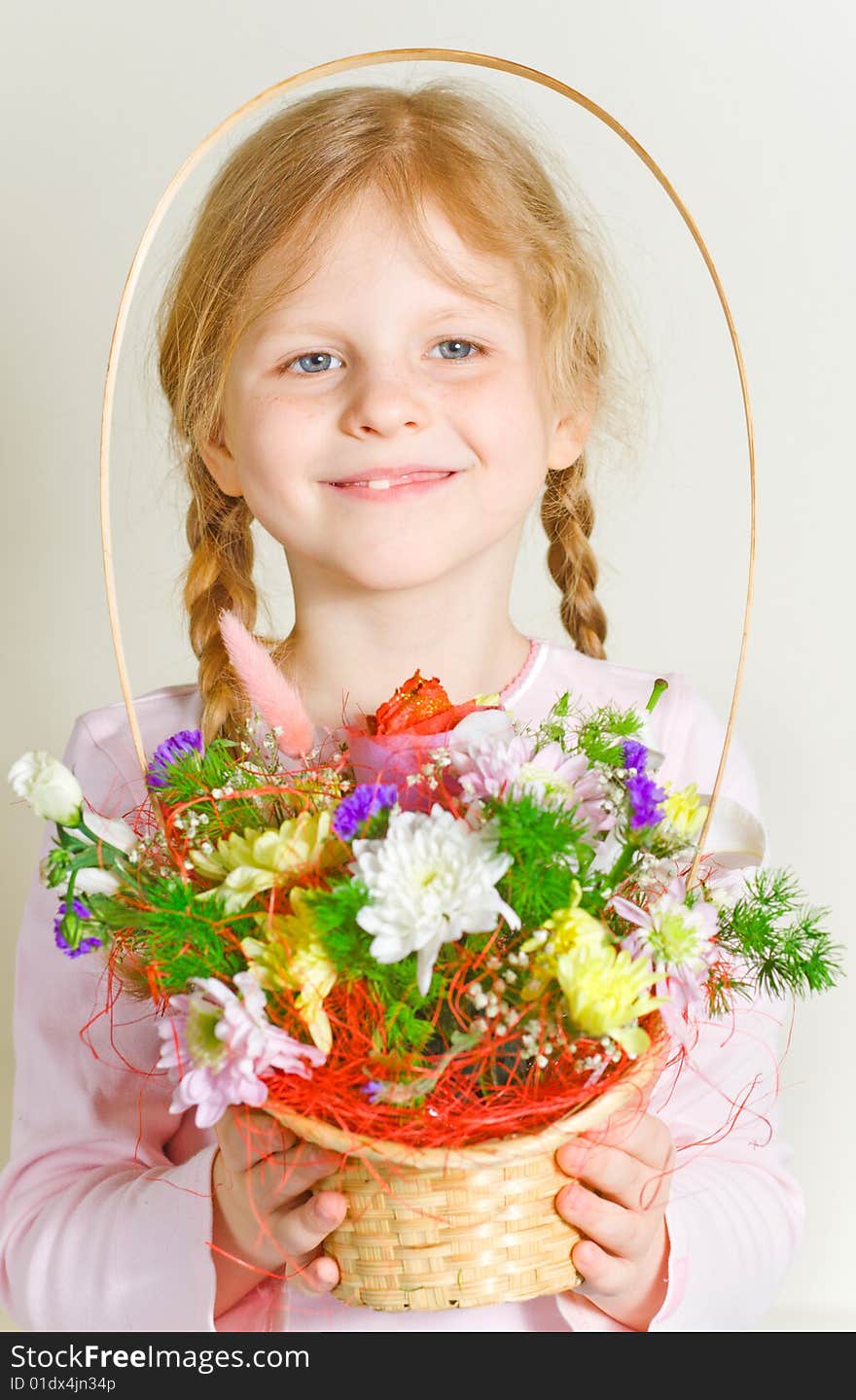 Small Girl With A Basket Of Flowers