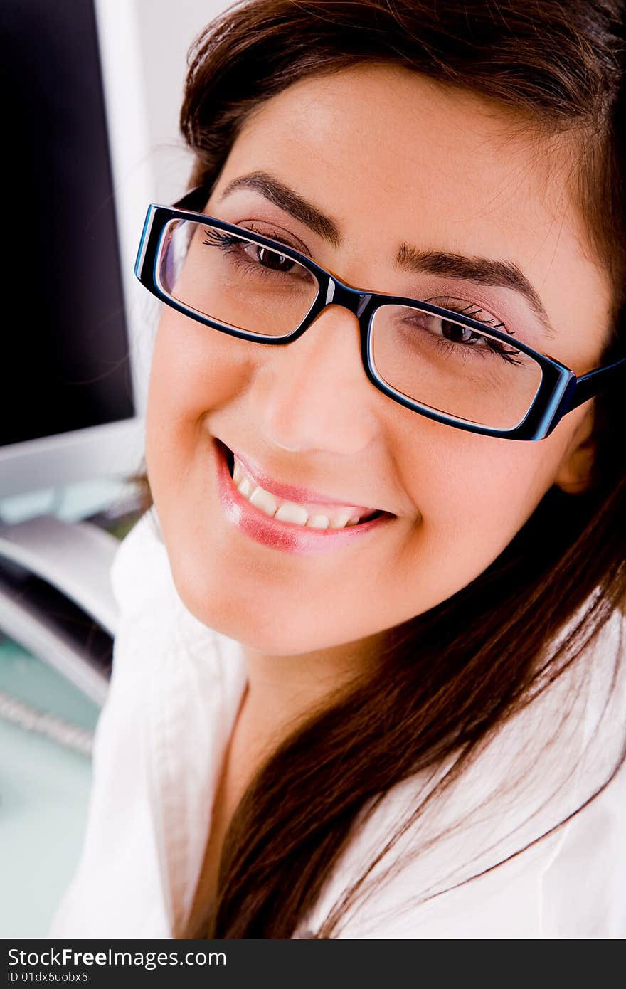 Portrait of woman in office wearing glasses