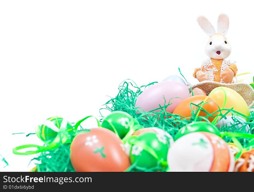 Easter setup with small basket full of eggs and bunny