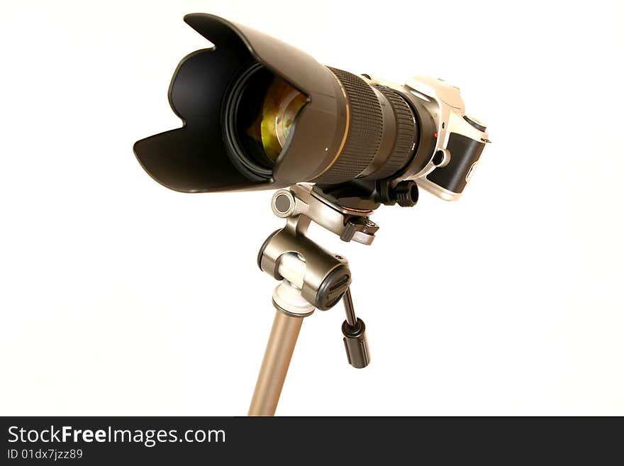 Professional tele lens on the tripod isolated on white. Professional tele lens on the tripod isolated on white.