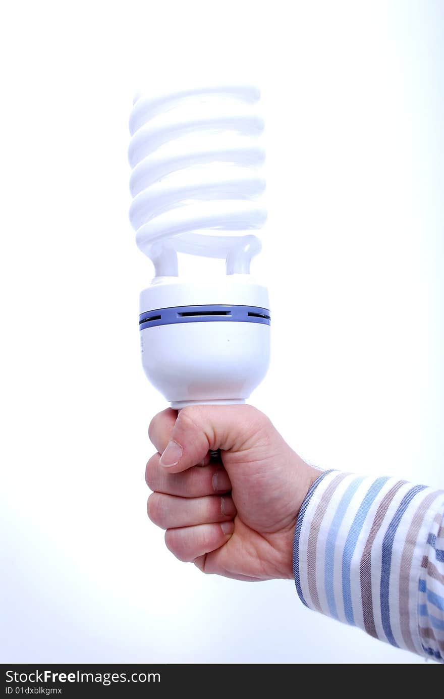 Hand holding energy save light bulb, white background. Hand holding energy save light bulb, white background