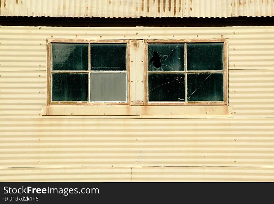 Windows on an old currugated metal building. Windows on an old currugated metal building.