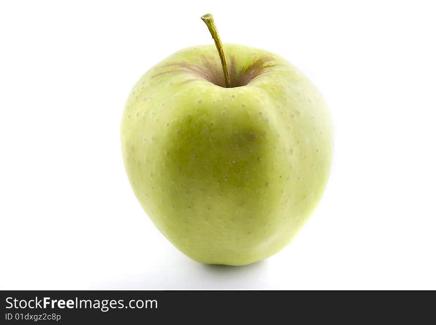 A fresh, crisp green apple isolated on a white background