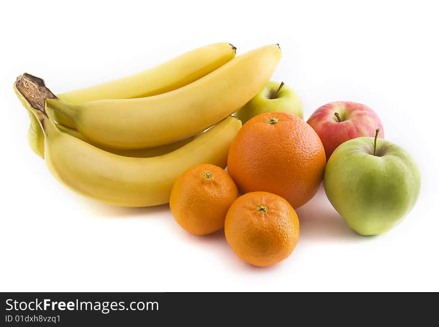 A group of common fruit isolated against a white background. A group of common fruit isolated against a white background