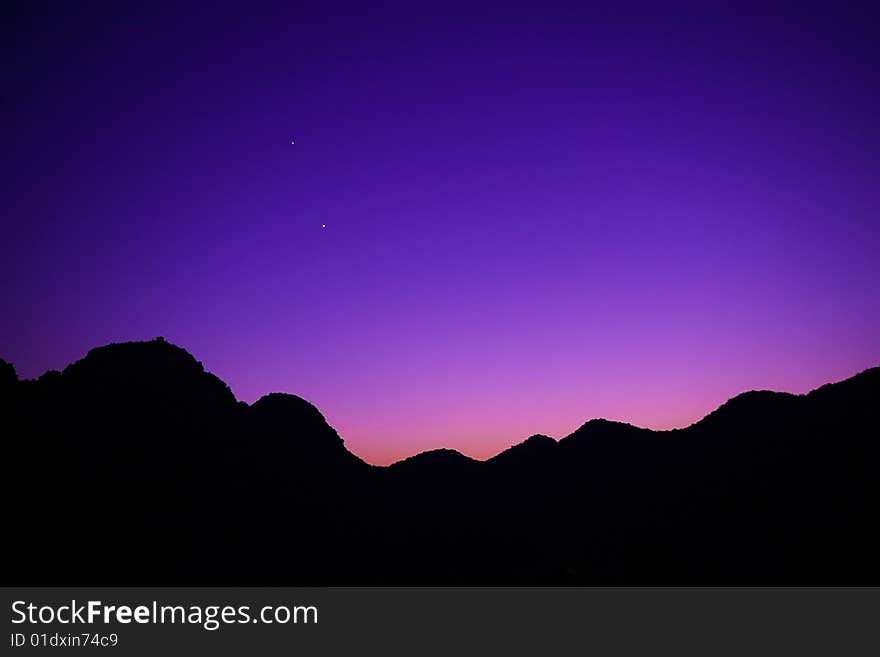 About to begin when the night sky, and mountains of the silhouette.