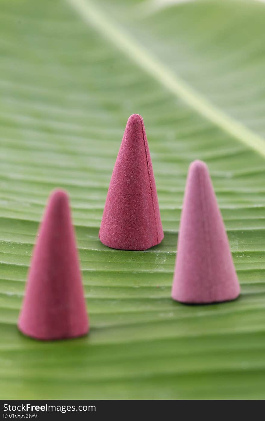 Sandalwood incense cones on banana leaf. Sandalwood incense cones on banana leaf