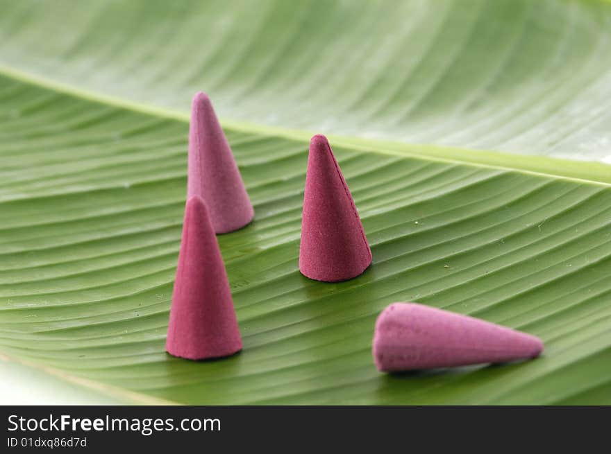 Sandalwood incense cones on banana leaf. Sandalwood incense cones on banana leaf