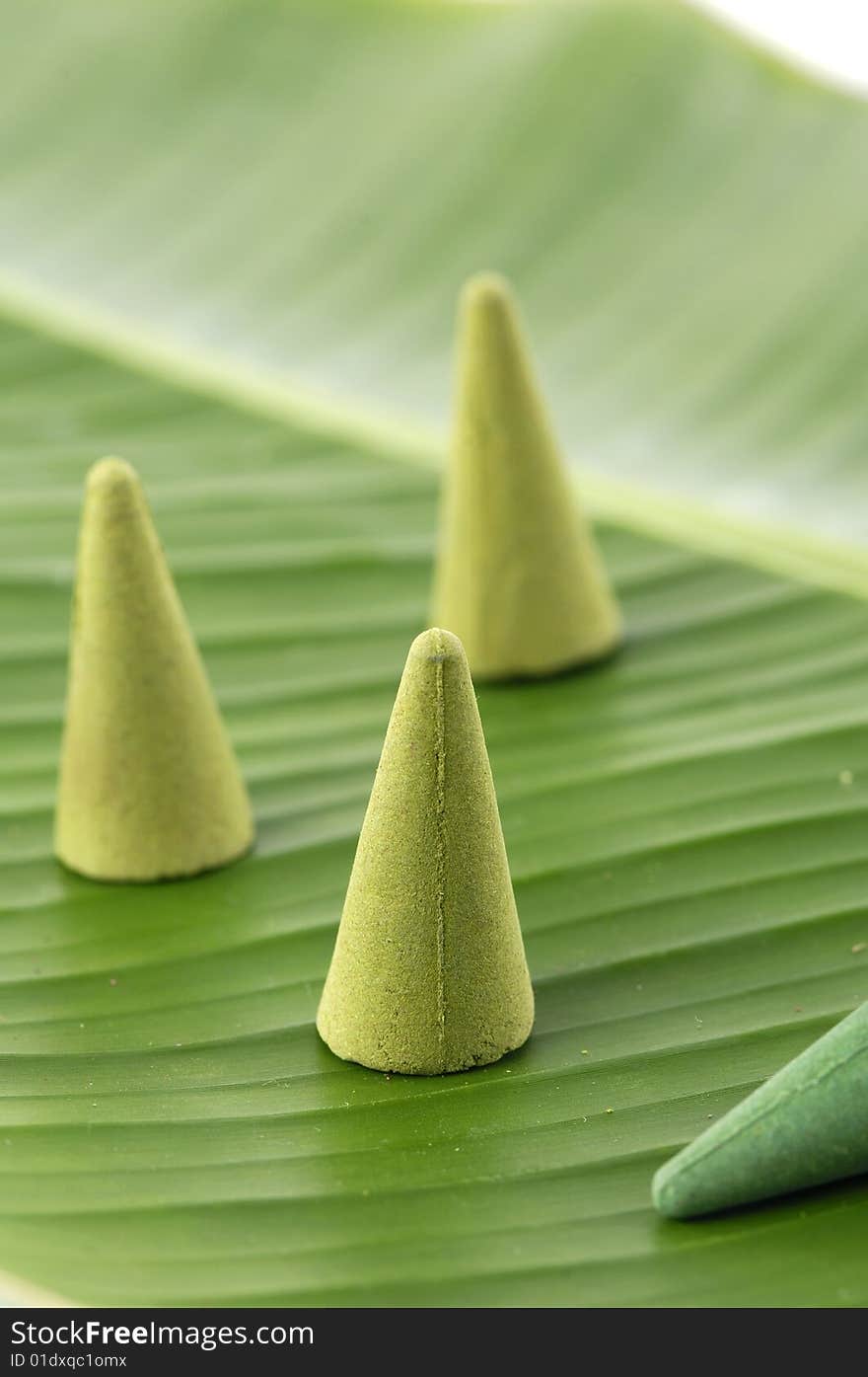 Sandalwood incense cones on banana leaf. Sandalwood incense cones on banana leaf