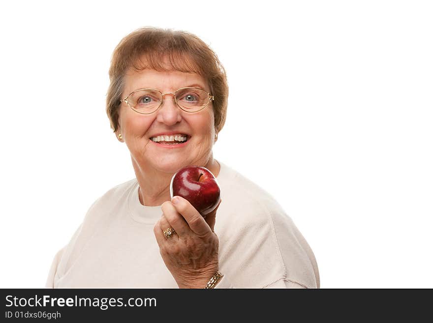 Attractive Senior Woman with Apple Isolated on a White Background.