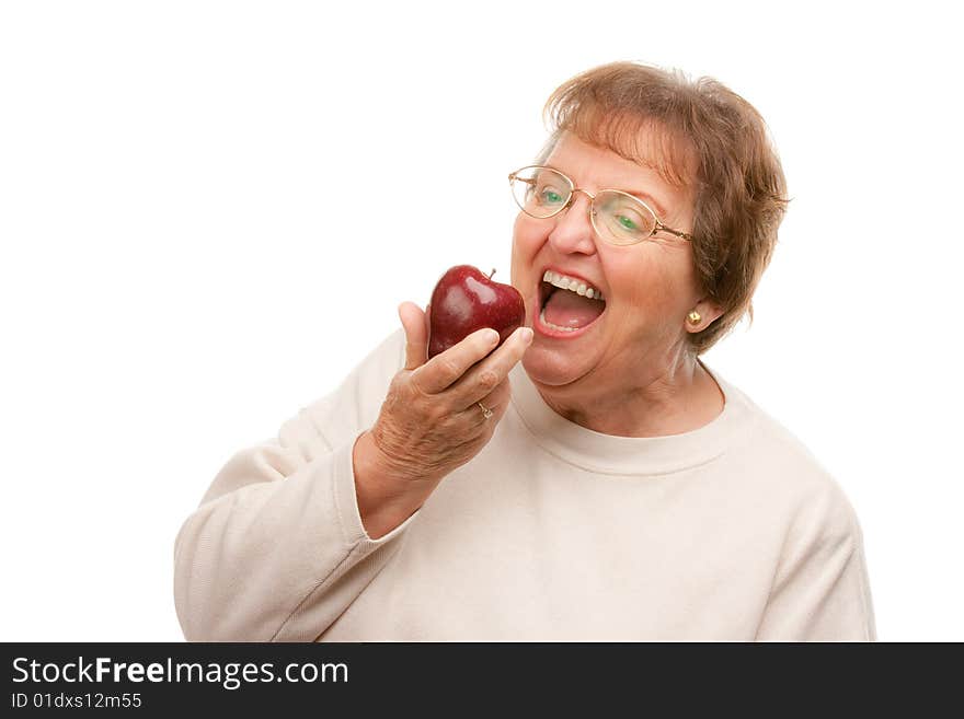 Attractive Senior Woman with Apple Isolated on a White Background.