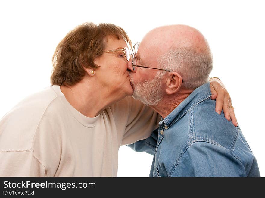 Affectionate Senior Couple Kissing Isolated on a White Background.