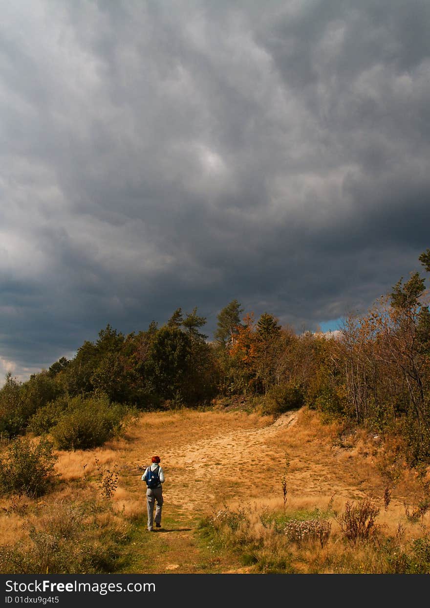 Solitaire hiker on a mountain path