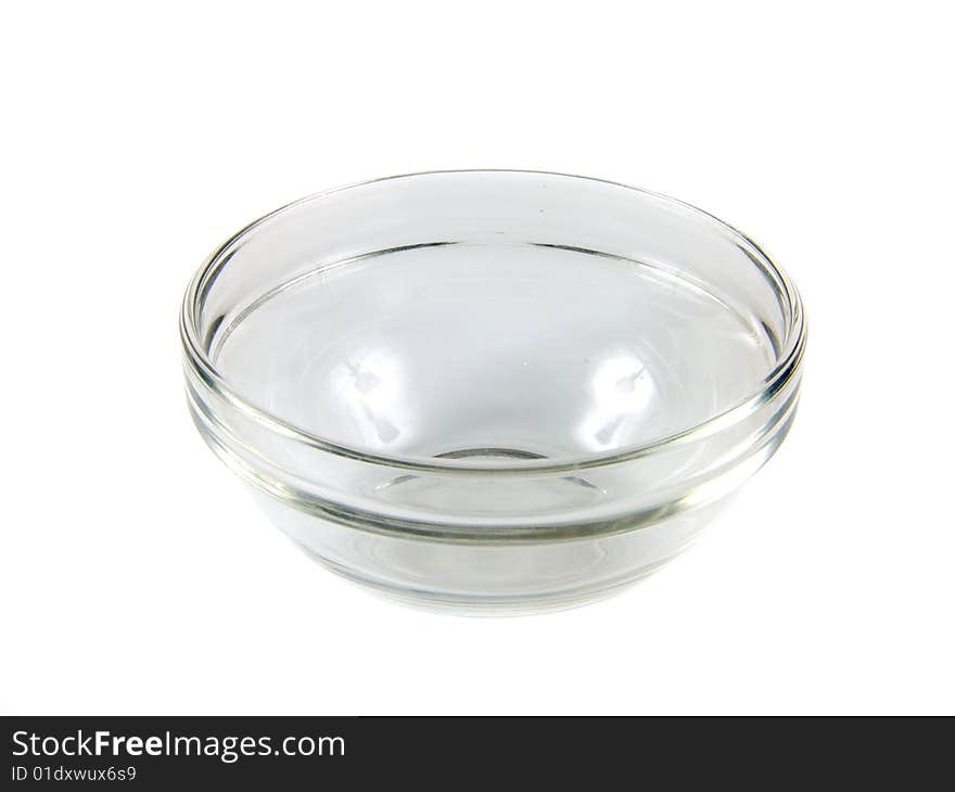 Transparent, small, glass cup on white background